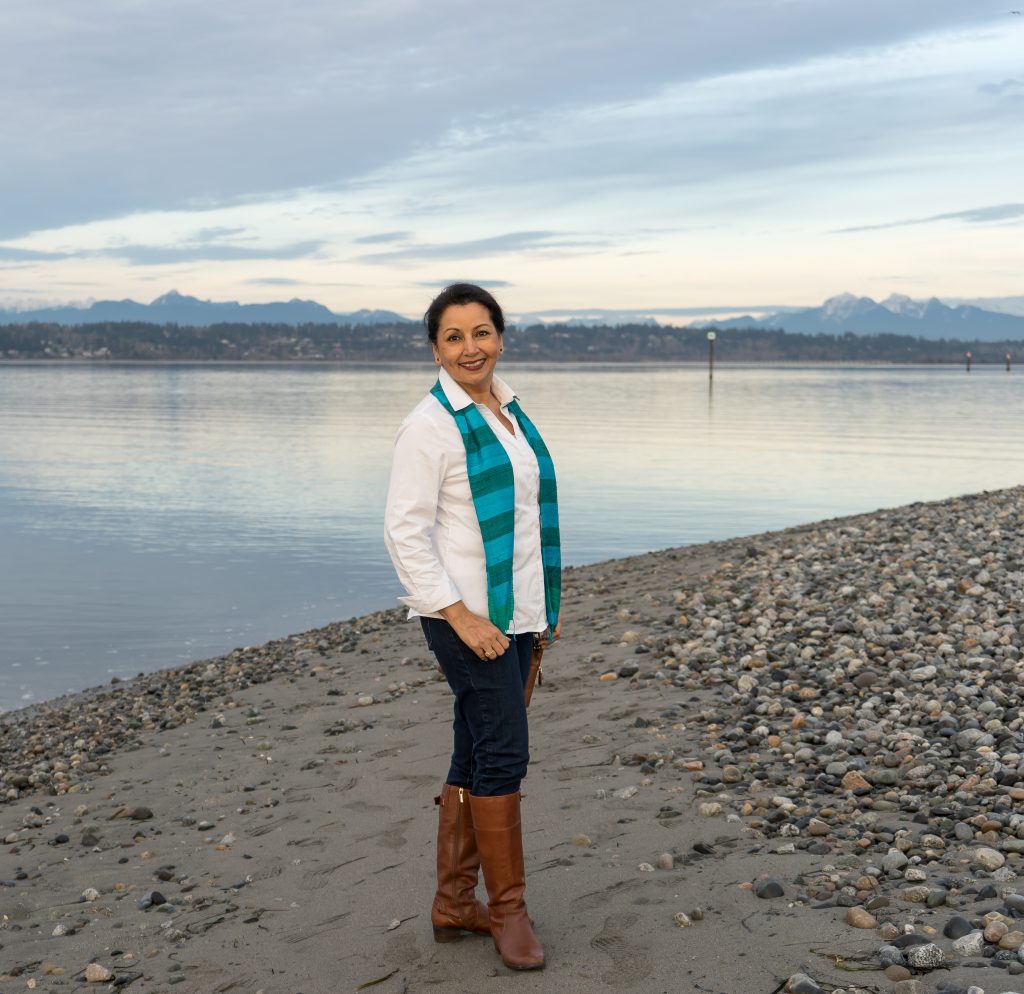 Classic white button down blouse, brown leather boots and silk scarf.