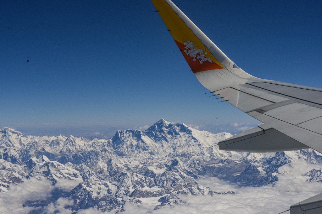 Druk Air plane flying over Mount Everest for our 7 day Bhutan Itinerary 