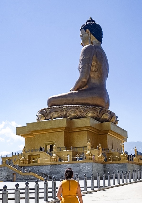 Lady walking up to statue of Buddha Dordenma, Bhutan during our our 7 day Bhutan Itinerary 