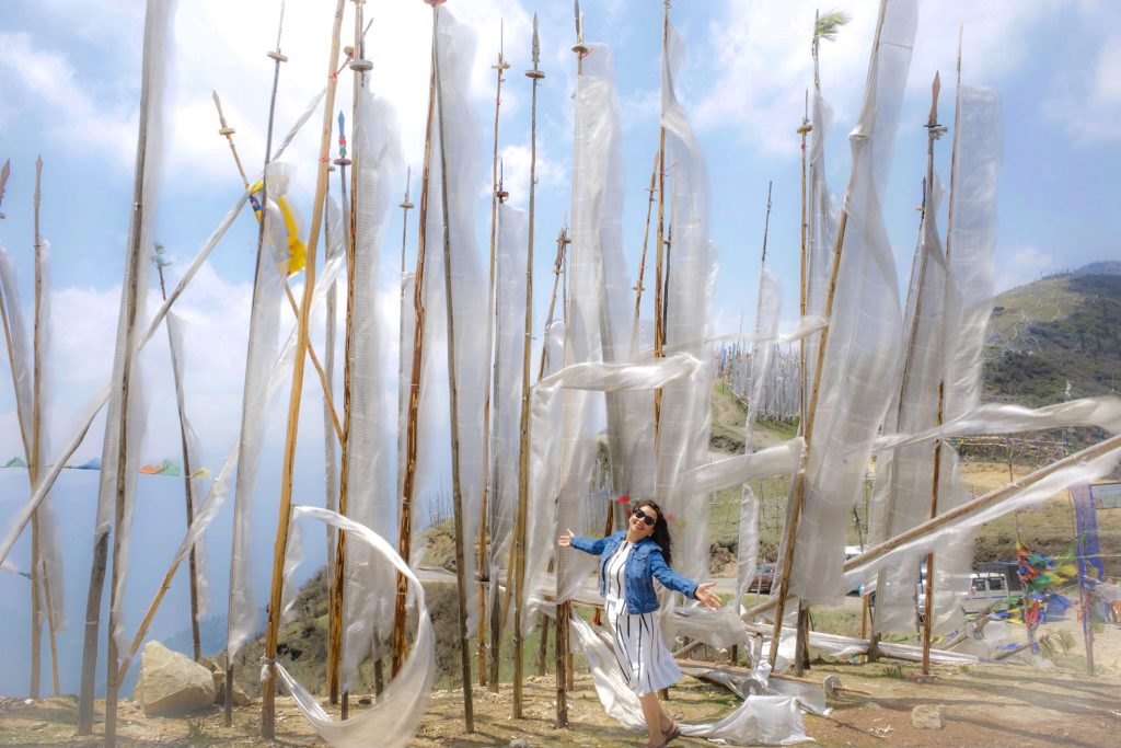 tourist with white flags in Bhutan