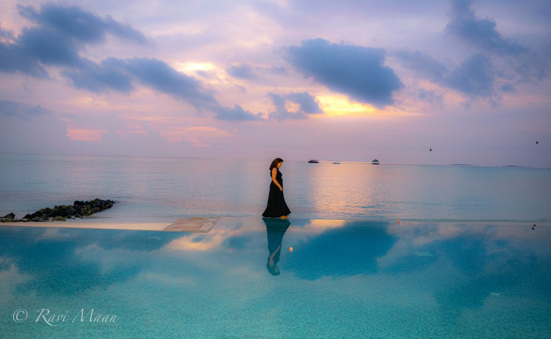 Woman's reflection in the water