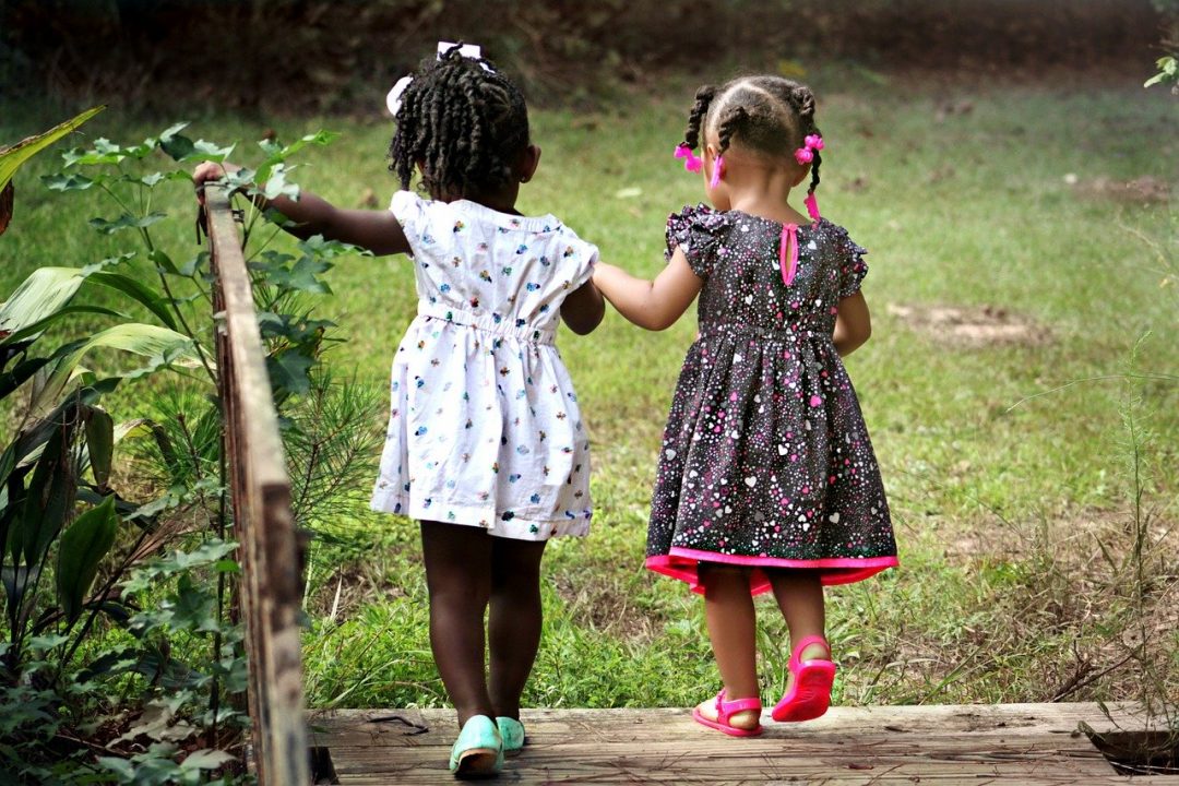 two girls forming a beautiful connection